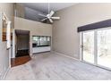Spacious living room featuring high ceilings, wet bar, and sliding door leading to outdoor space at 84 Ridgeport Rd # B, Clover, SC 29710