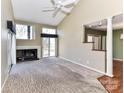 Inviting living room with fireplace, natural light, and open access to dining and kitchen areas at 84 Ridgeport Rd # B, Clover, SC 29710