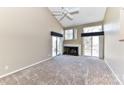 Bright living room features a fireplace, ceiling fan, and sliding glass door access to the deck at 84 Ridgeport Rd # B, Clover, SC 29710