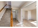 Inviting foyer with hardwood floors, staircase with carpet runner, and ample natural light creating a warm welcome at 9534 Blossom Hill Dr, Huntersville, NC 28078