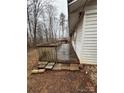 Backyard of home featuring a wooden deck with a wooded view at 1031 Cheatham Ford Rd Cheatham Ford Rd, Hiddenite, NC 28636