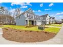 A modern two-story home boasting a well-maintained lawn and contemporary design at 118 Golden Trl, Mooresville, NC 28115