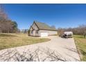 Spacious driveway leading to an oversized garage offers ample parking with additional space for boat storage at 125 Round Tuit Ln, Mt Ulla, NC 28125