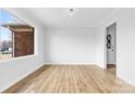 Bright living room featuring wood-look flooring and a large window with natural light at 137 Dellinger Dr, Statesville, NC 28625
