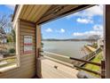 Enjoy lake views from this private balcony, complete with awning and lake decor at 14021 Queens Harbor Rd, Charlotte, NC 28278