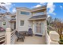 Exterior view showing an entryway and porch with chairs and a table, perfect for enjoying outdoor moments at 14021 Queens Harbor Rd, Charlotte, NC 28278