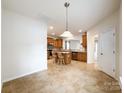 Open kitchen area with tile floor, island, and stainless steel microwave at 2023 Moultrie Ct, Fort Mill, SC 29707
