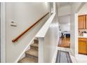 Carpeted stairs with wooden handrail leading to the upper level of the home at 2232 Mancke Dr, Rock Hill, SC 29732