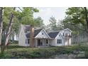 Beautiful modern home with back porch, a brick chimney, and views of the surrounding lush landscape at 324 Bridgewater Ln, Mooresville, NC 28117
