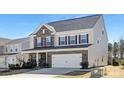 Charming two-story home featuring brick accents, a spacious two-car garage, and manicured landscaping at 4253 Spadefoot Ct, Lancaster, SC 29720