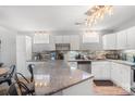 Bright kitchen showcasing granite countertops, stainless steel appliances, and white cabinetry at , Hickory, NC 28601