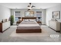 Spacious bedroom with a large bed, ample closet space and neutral decor at 11124 Chastain Parc Dr, Charlotte, NC 28216