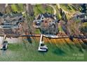 Waterfront home with private dock, lush landscaping, and lake views at 122 N Longfellow Ln, Mooresville, NC 28117