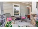 Cozy front porch with rocking chairs and decorative pillows, perfect for relaxing outdoors at 14827 Batteliere Dr, Charlotte, NC 28278