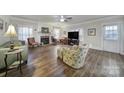 Inviting living room featuring a fireplace, hardwood floors, and neutral color palette at 1612 Forum Ln, Iron Station, NC 28080