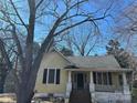Cozy house with a welcoming front porch and classic design at 201 N Crawford St, Monroe, NC 28112