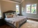 Cozy bedroom with large windows and plush rug and neutral decor at 32 Shanklin S Ln # 32, Denver, NC 28037