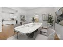 Open dining room with a modern marble table set, great for entertaining at 590 Main Sw St, Concord, NC 28027