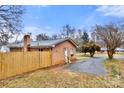 Brick home with a fenced yard at 7047 Cheyenne Dr, Charlotte, NC 28262