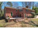 Brick home exterior with a concrete patio area, offering an inviting outdoor space at 8101 Kerrybrook Cir, Charlotte, NC 28214