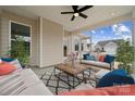 Cozy screened-in porch with seating, a ceiling fan, and natural light at 884 Exeter Dr, Sherrills Ford, NC 28673