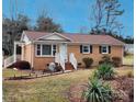 Charming brick home with a well-manicured lawn and inviting front entrance at 114 Eller Rd, Gastonia, NC 28056