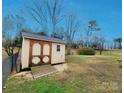 A shed with a natural wood finish at 114 Eller Rd, Gastonia, NC 28056