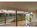 This covered porch offers a view to the neighborhood and includes a cozy swing at 115 Setter Ct, Statesville, NC 28625