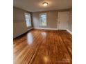 Bright living room with wood floors, complemented by fresh paint, windows and ample natural light at 120 3Rd Ave, Conover, NC 28613