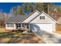 Charming single-Gathering home with a welcoming front porch and attached two-car garage at 3041 Mulberry Ln, Lancaster, SC 29720