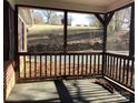 Relaxing screened porch with natural light and views of the surrounding greenery at 314 Little St, Lincolnton, NC 28092