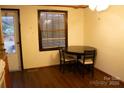 Bright kitchen nook with wood flooring, and a small table with seating for casual dining at 522 Perry St, Troy, NC 27371