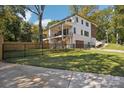 Beautifully designed two-story home with a large yard, fenced-in area, and a private driveway at 5610 Farmbrook Dr, Charlotte, NC 28210