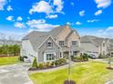 Expansive property showcases a well-manicured lawn and charming two-story home with lush landscaping at 6022 Candlestick Ln, Lancaster, SC 29720
