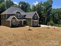 Charming two-story home with a large yard and a modern gray color scheme at 7221 Static Way # 13, Sherrills Ford, NC 28673