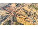 Aerial view of land with varied terrain including open fields and wooded sections, all within a defined boundary at 7270 Long Island Rd, Catawba, NC 28609