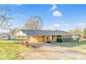 Charming ranch-style home with an attached carport and storage shed, perfect for comfort and practicality at 7270 Long Island Rd, Catawba, NC 28609