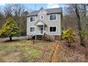 Charming two-story home with gray roof and a landscaped yard, and a cozy front porch at 946 Laurelwood Dr, Clover, SC 29710