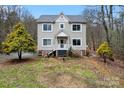 Charming two-story home with gray roof and a landscaped yard, and a cozy front porch at 946 Laurelwood Dr, Clover, SC 29710
