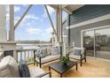 Relax on the balcony with lake views and comfortable outdoor seating at 1008 Southwest Dr # 8, Davidson, NC 28036