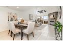 Bright open-concept living space with fireplace and access to outdoor balcony at 1008 Southwest Dr # 8, Davidson, NC 28036