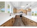 Well-lit kitchen with ample countertop space, island, and modern appliances at 109 Stonewater Dr # 26, Red Cross, NC 28129