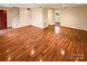 Spacious living room featuring hardwood floors and neutral color scheme at 10905 Park Rd, Charlotte, NC 28226