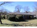 Classic brick home with a well-kept lawn and mature landscaping, offering timeless appeal at 121 Quincy Dr # 1, Belmont, NC 28012