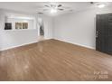 Spacious living room with hardwood floors and neutral paint at 13413 Glasgow Green Ln, Charlotte, NC 28213
