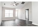 Bright living room with vaulted ceilings, windows with blinds, and dark wood flooring at 1517 Tiana Way, Rock Hill, SC 29732