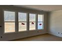 Bright, spacious room with large windows and neutral walls, ready to be customized at 237 Miramar Dr, York, SC 29745