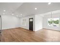Open living space with hardwood flooring, recessed lighting, and neutral paint perfect for entertaining and relaxation at 2425 Ellen Ave, Charlotte, NC 28208