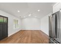 Inviting living area with hardwood floors, recessed lights, and stainless steel appliances at 2429 Ellen Ave, Charlotte, NC 28208