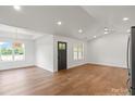 Spacious living room features hardwood floors, recessed lighting and big windows at 2429 Ellen Ave, Charlotte, NC 28208